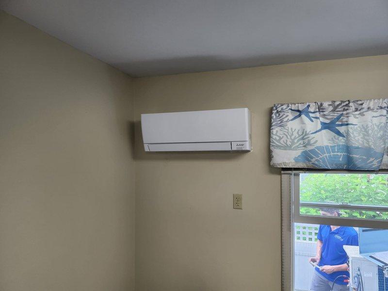 Removed and disposed of existing HVAC equipment. Installed complete Mitsubishi multi-zone ductless heat pump system consisting of one MXZ-5D36NL outdoor unit, one MSZ-GX18NL indoor fan coil, and two MSZ-GX09NL indoor fan coils. Furnished and installed new communication wiring between indoor and outdoor units. Utilized existing refrigeration lines and condensate drainage system. Mounted outdoor unit on existing equipment stand and installed surge disconnect for electrical protection. All indoor wall-mounted units installed in designated rooms with proper clearances and secured to wall studs. System tested for proper operation including heating and cooling modes, refrigerant pressures, and airflow from all zones. Verified communication between outdoor unit and all three indoor fan coils functioning correctly. System left operational and customer instructed on basic thermostat functions and remote control operation.
