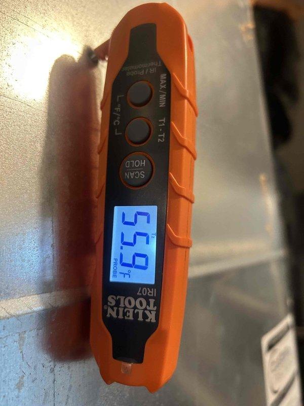 Responded to morning service call from contract maintenance customer requesting estimated time of arrival. Performed preventive maintenance cooling visit on two HVAC systems as scheduled under recurring service agreement. Conducted temperature measurements using infrared thermometer on system components and ductwork, recording supply air temperature of 55.5°F and surface temperature readings of 57.0°F to verify proper cooling operation and system performance.