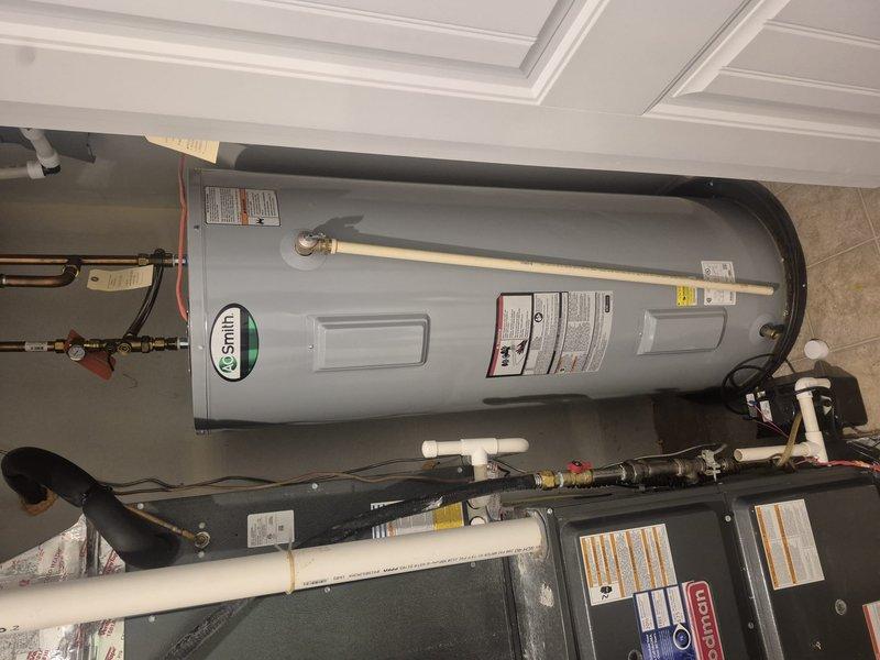 Provided comprehensive estimate for replacement of existing 80-gallon residential water heater. Assessed current installation including expansion tank, copper supply lines with brass fittings and shutoff valves, pressure relief components, and electrical connections. Evaluated utility room configuration and existing plumbing infrastructure to determine scope of work required for new unit installation, including proper venting, code-compliant connections, and integration with HVAC system in shared mechanical space.