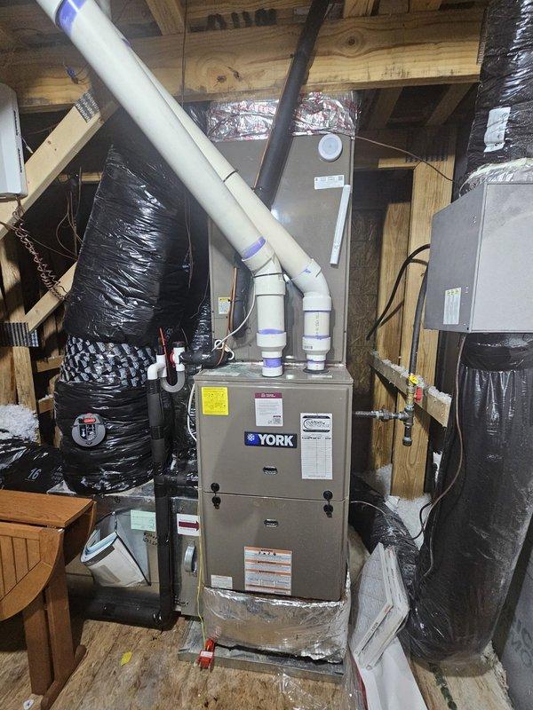 Completed preventive maintenance inspection on York HVAC system consisting of gas furnace located in attic space and outdoor condensing unit. Performed comprehensive tune-up including filter inspection, electrical connection verification, refrigerant level assessment, and overall system operational check. All components found to be functioning properly with no deficiencies noted. System tested and left in normal operating condition.
