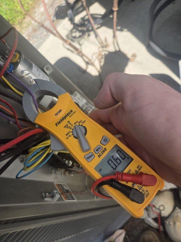 Responded to no cooling complaint with outdoor unit not functioning. Upon arrival, confirmed ODU had no power. Performed electrical diagnostics using clamp meter and multimeter to test voltage at contactor and verify power supply to unit. Measured incoming line voltage at 138V, indicating low voltage condition preventing proper operation. Identified low voltage as root cause of no ODU function. Advised customer of findings and recommended contacting utility company to address inadequate voltage supply, as this is beyond HVAC system issue and requires electrical service correction before unit can operate properly.