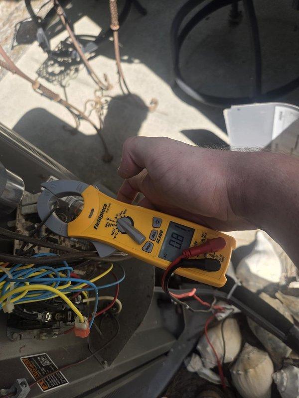 Responded to no cooling complaint with outdoor unit not functioning. Upon arrival, confirmed ODU had no power. Performed electrical diagnostics using clamp meter and multimeter to test voltage at contactor and verify power supply to unit. Measured incoming line voltage at 138V, indicating low voltage condition preventing proper operation. Identified low voltage as root cause of no ODU function. Advised customer of findings and recommended contacting utility company to address inadequate voltage supply, as this is beyond HVAC system issue and requires electrical service correction before unit can operate properly.