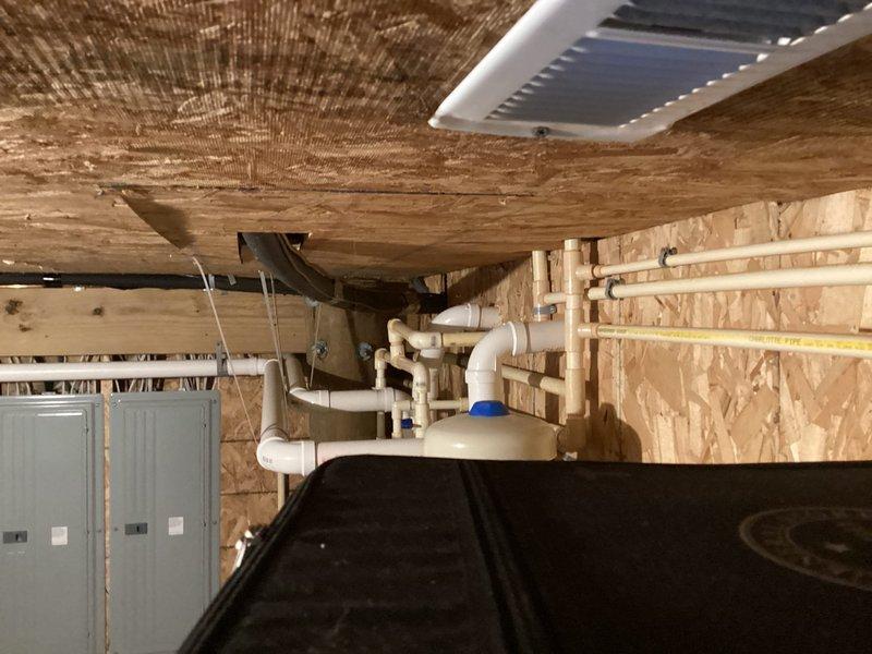 Completed scheduled tankless water heater maintenance visit as part of recurring service agreement. Performed comprehensive inspection of tankless unit, circulator pump, and associated plumbing connections in basement mechanical room. Verified proper operation of system components including red circulator pump, isolation valves, PVC supply and return lines, and copper piping connections. All equipment found operating within normal parameters with no leaks or deficiencies noted at time of inspection.