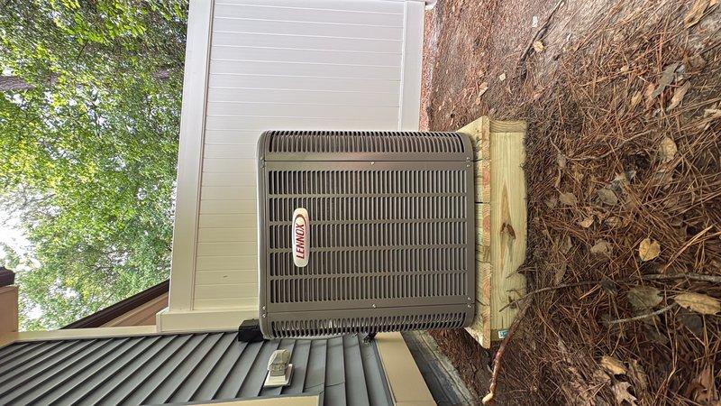 Completed full HVAC system replacement including removal and disposal of existing equipment. Installed Lennox ML14KC1-30 2.5 ton 14 SEER air conditioner on wooden platform, ML297UH070XV36 two-stage variable speed furnace with LP conversion kit, CK40CT-30/36B evaporator coil, and Honeywell S1200W WiFi thermostat. Flushed, pressure tested, and recharged refrigeration lines to manufacturer specifications. Verified system operation with draft pressure reading of 3.25 inches water column. System commissioned and operational with one-year comprehensive warranty coverage.