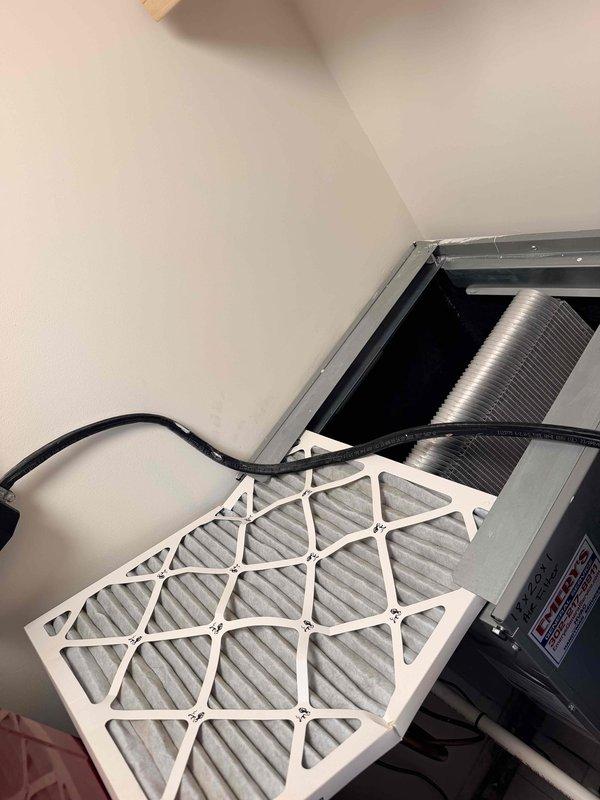 Responded to rental property for HVAC system evaluation after refrigerant leak was discovered in evaporator coil approximately one year after installation by another contractor. Inspected air handler unit located in utility closet alongside water heater, documented existing equipment configuration including filter access and ductwork connections. Assessed attic-mounted components and verified leak location in coil assembly. Provided estimate for complete system replacement per property owner's request due to warranty concerns with previous installation.