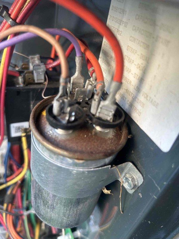 Responded to emergency no-cooling call on five-year-old air conditioning system at rental property. Upon inspection, identified failed capacitor with significant corrosion on mounting cap and confirmed diagnosis using thermal imaging to verify lack of heat transfer at evaporator coil, which registered abnormally low temperatures (45-60°F range) indicating refrigerant flow issues caused by compressor not operating. Replaced defective capacitor, restored all electrical connections, and verified system returned to normal cooling operation.