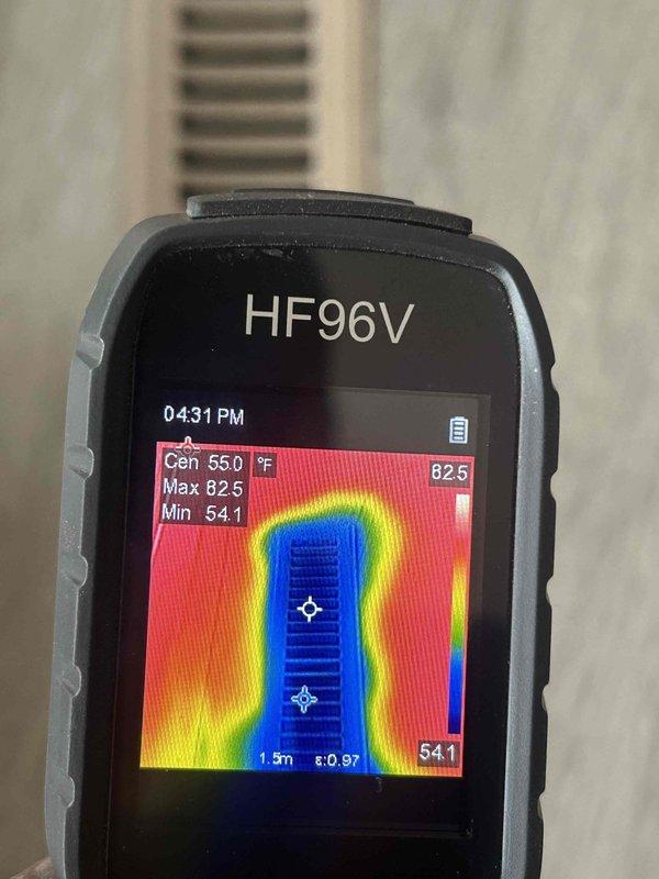 Responded to emergency no-cool call and performed diagnostic evaluation of air conditioning system. Utilized thermal imaging camera to measure supply air temperature at register, confirming inadequate cooling with center temperature reading of 55.0°F. Measured return air temperature at 78.5°F on main trunk line, indicating insufficient temperature split across the system. Temperature differential of approximately 23°F falls below the standard 15-20°F range expected for proper cooling operation, suggesting potential refrigerant charge issues, compressor malfunction, or airflow restrictions requiring further investigation and repair.