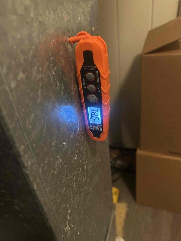 Responded to emergency no-cool call and performed diagnostic evaluation of air conditioning system. Utilized thermal imaging camera to measure supply air temperature at register, confirming inadequate cooling with center temperature reading of 55.0°F. Measured return air temperature at 78.5°F on main trunk line, indicating insufficient temperature split across the system. Temperature differential of approximately 23°F falls below the standard 15-20°F range expected for proper cooling operation, suggesting potential refrigerant charge issues, compressor malfunction, or airflow restrictions requiring further investigation and repair.