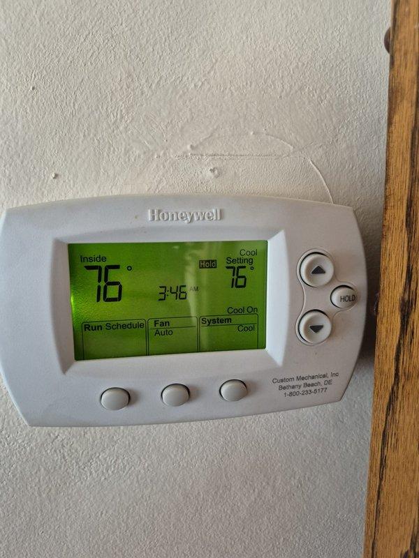 Completed scheduled cooling maintenance visit on residential HVAC system. Upon arrival, verified thermostat operation showing 76°F setpoint with system running in cooling mode. Performed electrical diagnostics using clamp meter at condensing unit, measuring compressor amperage at 5.95 amps with 0.1 amp reading on secondary circuit, confirming proper electrical operation within manufacturer specifications. System operating normally with no deficiencies noted.