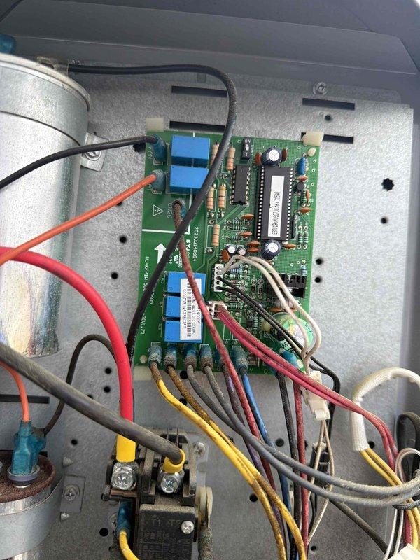 Responded to no cooling call on residential HVAC system over 10 years old that was not reaching set temperature. Inspected unit specifications and control board, documented manufacturer data plate showing R410a refrigerant system with electrical ratings, and examined circuit board with terminal connections and control wiring for proper operation.