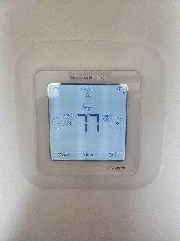 Responded to cooling complaint for lower floor system not maintaining temperature. Performed diagnostic evaluation of HVAC system and verified thermostat operation showing 77°F ambient temperature with system in cooling mode. Identified and resolved issue affecting cooling performance, confirmed proper thermostat communication and system cycling, and verified adequate airflow with existing filters onsite.
