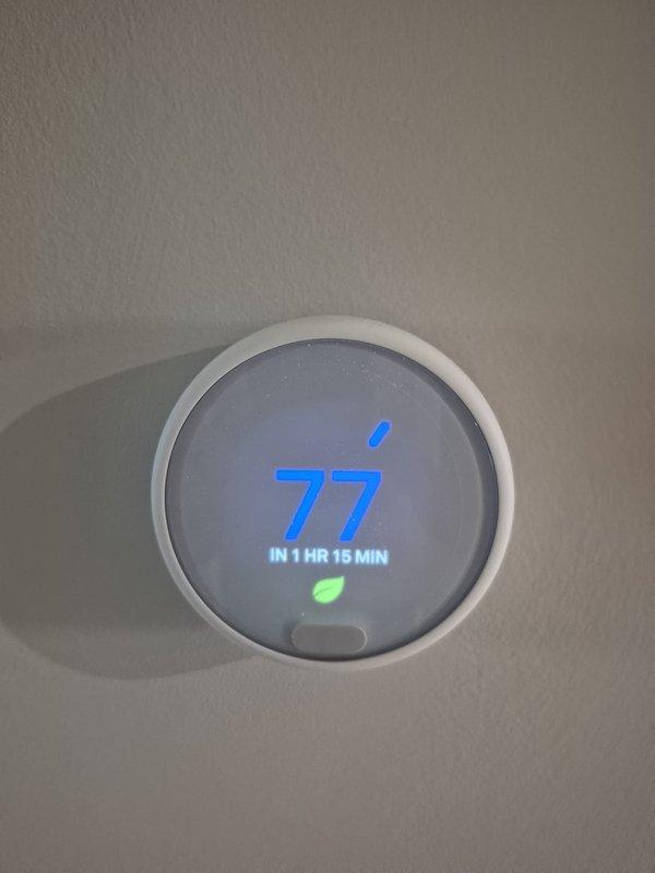 Completed routine cooling maintenance visit on residential HVAC system. Performed standard diagnostic checks including electrical measurements at outdoor unit, verified proper amperage draw of 448 amps, and confirmed thermostat operation showing 77°F setpoint with system scheduled to activate in 1 hour 15 minutes. All components operating within normal parameters and system found to be functioning properly with energy-saving mode enabled.