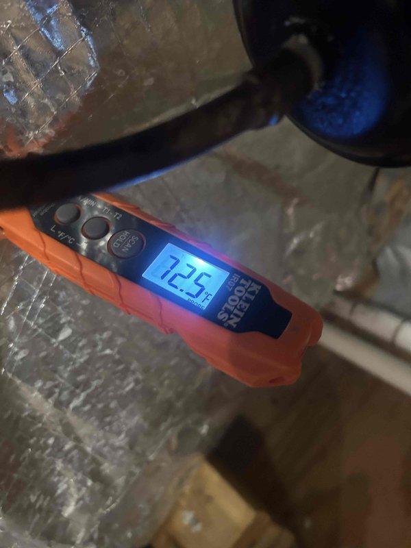 Performed routine cooling system maintenance and temperature verification. Supply air temperature measured at 72.5°F at the air handler, with return air temperature reading 91.5°F at the ductwork, confirming proper system operation with approximately 19°F temperature differential across the evaporator coil.