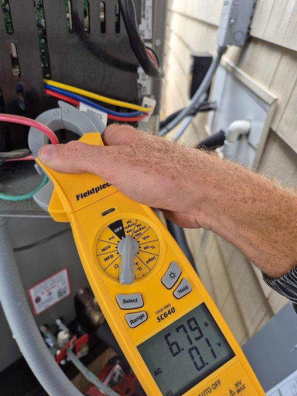 Completed routine cooling maintenance visit on two HVAC systems. Performed electrical diagnostics using clamp meter and multimeter to verify proper voltage, amperage, and system performance on outdoor condensing units. All electrical readings were within manufacturer specifications, and both systems were operating normally at time of service.