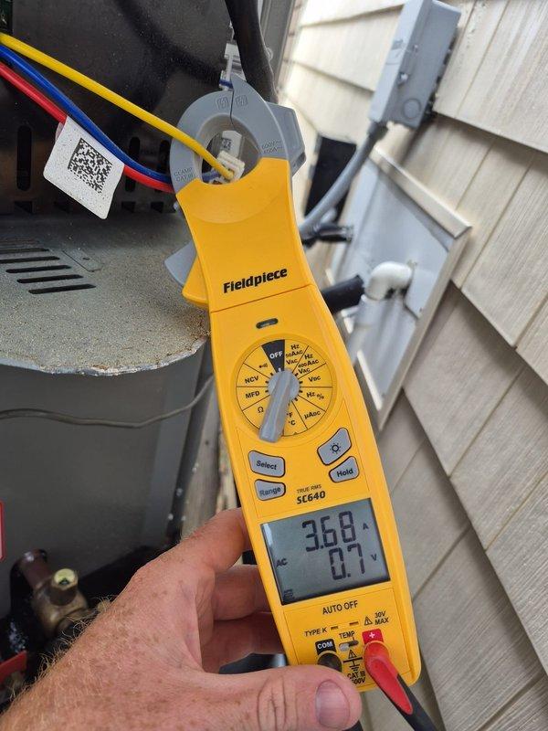 Completed routine cooling maintenance visit on two HVAC systems. Performed electrical diagnostics using clamp meter and multimeter to verify proper voltage, amperage, and system performance on outdoor condensing units. All electrical readings were within manufacturer specifications, and both systems were operating normally at time of service.
