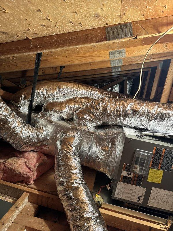 Completed full HVAC system replacement for single-system residence. Removed and disposed of existing equipment. Installed ML14KP1-024 2-ton 14 SEER heat pump outdoor unit on risers utilizing existing pad. Installed CBK45UHPT-24 fan coil unit in drain pan with shutoff valve in attic space. Replaced two 6-inch supply ducts and one short run of 5-inch flexible ductwork in attic. Installed ECB140CB 10KW electric heater with breaker for supplemental heating. Installed electrical whip and disconnect for outdoor unit. Flushed, pressure tested, and recharged refrigeration lines to manufacturer specifications. Installed S1200W WiFi thermostat for system control. System tested and operational with one-year comprehensive warranty coverage on new equipment.