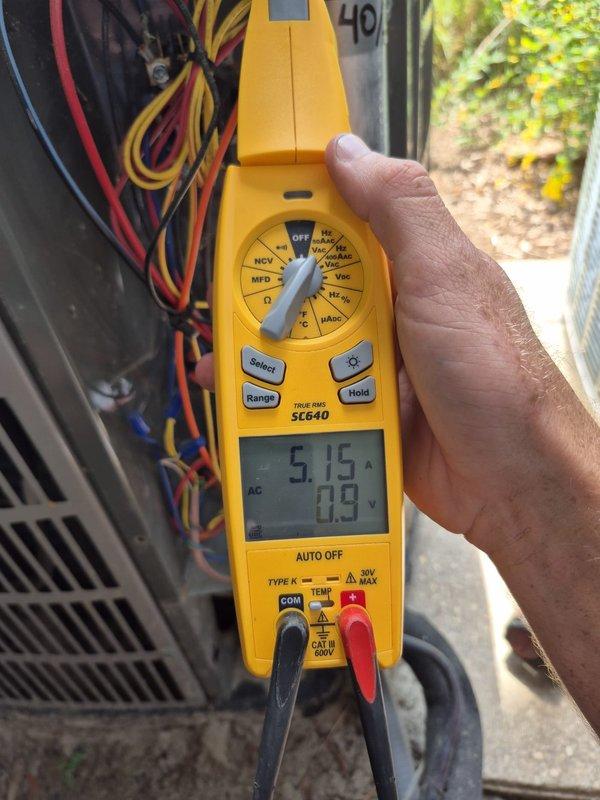 Completed scheduled preventive maintenance cooling visit on residential HVAC system. Performed comprehensive system diagnostics including electrical measurements using multimeter, verified compressor amperage draw at 5.15 amps within normal operating parameters. Confirmed thermostat operation with Honeywell programmable unit maintaining setpoint at 75°F in cooling mode with fan running continuously, system cycling properly and maintaining desired temperature.