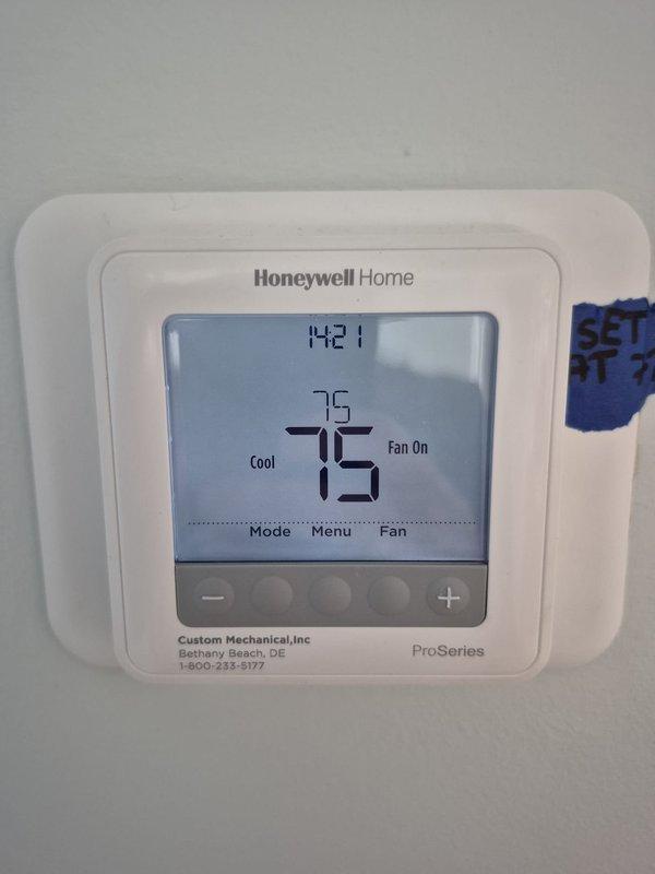 Completed scheduled preventive maintenance cooling visit on residential HVAC system. Performed comprehensive system diagnostics including electrical measurements using multimeter, verified compressor amperage draw at 5.15 amps within normal operating parameters. Confirmed thermostat operation with Honeywell programmable unit maintaining setpoint at 75°F in cooling mode with fan running continuously, system cycling properly and maintaining desired temperature.