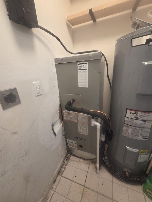 Completed full HVAC system replacement including removal and disposal of existing equipment. Installed American Standard 2.5-ton 14 SEER heat pump (model 5A6H4030A1000A) with matching air handler (model 5TEM4B03AC31) in utility room. Added 18.5" filter rack for coil protection and 10kw electric heat pack for auxiliary heating. Fabricated and installed metal duct transitions to adapt new equipment to existing ductwork. Reused existing condensate drain lines while replacing outdoor disconnect and electrical whip for code compliance. Mounted outdoor heat pump unit on pressure-treated wood platform. Installed Honeywell digital WiFi thermostat for system control. Reconnected refrigerant lines and electrical connections, verified proper airflow, and tested all system functions. Unit operating within manufacturer specifications with one-year parts and labor warranty from installation date.