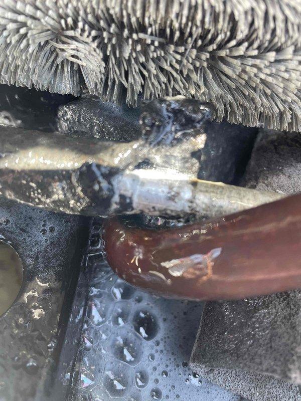 Responded to no cooling complaint on 10+ year old rooftop air conditioning unit. Upon arrival, found system shut off and unable to reach setpoint temperature. Performed diagnostic evaluation of outdoor condensing unit and associated refrigerant lines. Inspected condenser coil, compressor operation, and electrical components. Evaluated copper refrigerant line connections showing oxidation and corrosion indicative of system age. Checked flexible ductwork connections and indoor air handler components. Identified age-related wear on copper piping with visible tarnishing and discoloration at connection points. System assessed and recommendations provided for repair or replacement options given unit age exceeding ten years.