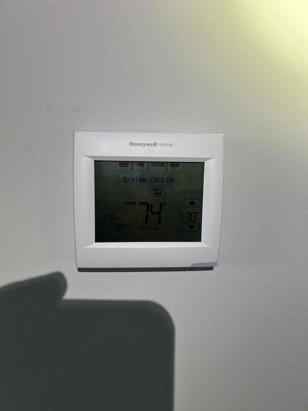 Completed warranty repair on upstairs Trane air handler system (Model: TAM9A0C36V31DAB, Serial: 20532BCE1V). Replaced failed EEV valve body with stem, EEV strainer on liquid line, EEV control board, and filter drier. System restored to proper cooling operation with thermostat displaying normal function at 74° setpoint.