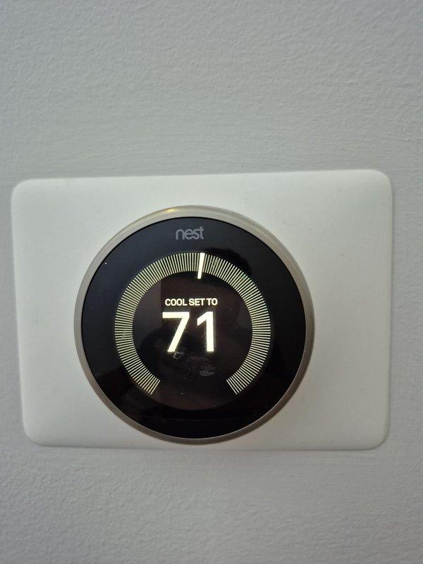 Completed scheduled cooling maintenance visit on residential HVAC system. Performed electrical diagnostics on gas heating components, measuring amperage draw of 7.07A to verify proper operation of system controls and safety devices. Confirmed Nest thermostat functioning correctly with cooling mode set to 71°F and verified proper communication between thermostat and HVAC equipment.