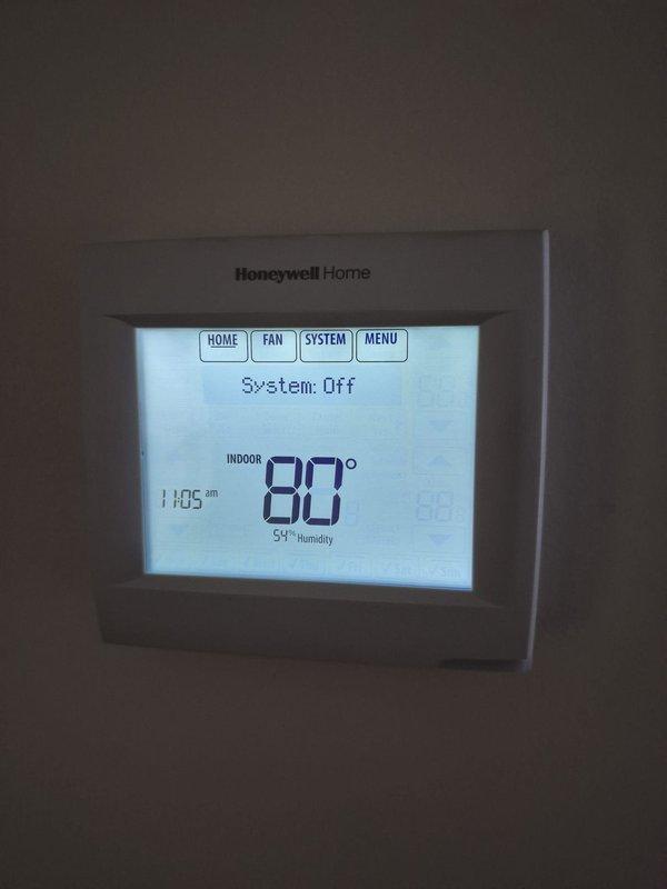 Responded to no cooling complaint and found system turned off at thermostat with indoor temperature at 80°F and 55% humidity. Instructed customer to turn system back on and verified thermostat was functioning properly with clear display and responsive controls. No mechanical issues identified as unit was simply switched off.