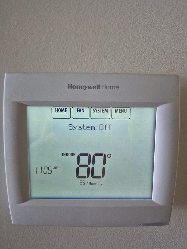 Responded to no cooling complaint and found system turned off at thermostat with indoor temperature at 80°F and 55% humidity. Instructed customer to turn system back on and verified thermostat was functioning properly with clear display and responsive controls. No mechanical issues identified as unit was simply switched off.