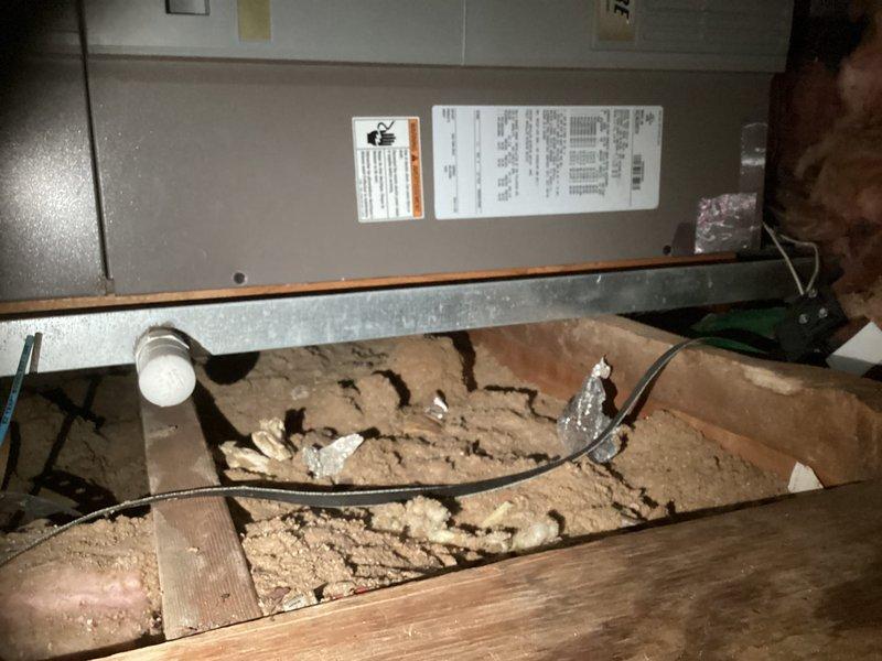 Conducted site evaluation of 17-year-old HVAC system showing significant deterioration with worn equipment data plates and compromised attic installation conditions. Assessed inadequate cooling capacity to second floor where portable window units are currently supplementing system performance. Prepared comprehensive replacement estimates including options for complete main system replacement and installation of ductless mini-split system with two indoor heads for improved upper-level climate control.
