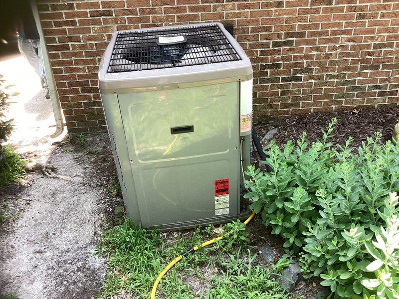 Conducted site evaluation of 17-year-old HVAC system showing significant deterioration with worn equipment data plates and compromised attic installation conditions. Assessed inadequate cooling capacity to second floor where portable window units are currently supplementing system performance. Prepared comprehensive replacement estimates including options for complete main system replacement and installation of ductless mini-split system with two indoor heads for improved upper-level climate control.