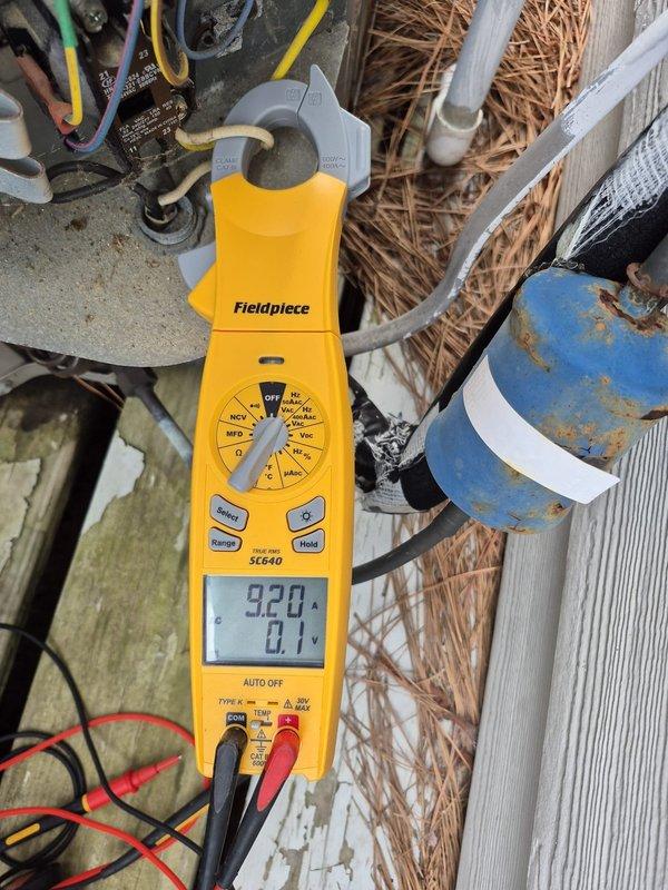Completed routine cooling maintenance visit on first of two HVAC systems at plantation property. Performed standard diagnostics including temperature measurements of supply air registers reading 75.2°F and electrical testing with clamp meter showing 920 reading on capacitor circuit. Inspected outdoor condensing unit which showed weathering and surface corrosion on compressor housing but remained operational, verified capacitor connections and wiring integrity, and confirmed proper system function upon completion.