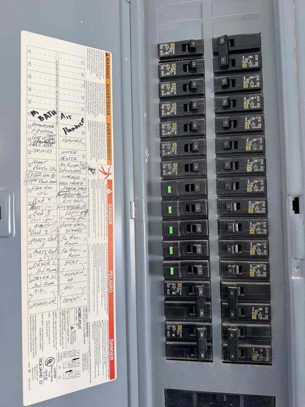Evaluated 18-year-old upstairs HVAC system operating on R-22 refrigerant and found refrigerant charge critically low. Assessed attic-mounted air handler unit and associated ductwork, determining complete system replacement necessary due to age and obsolete refrigerant type. Documented existing electrical panel configuration and downstairs HVAC equipment for comprehensive replacement quote preparation, providing multiple equipment options for both upstairs full system replacement and downstairs air conditioning component replacement.
