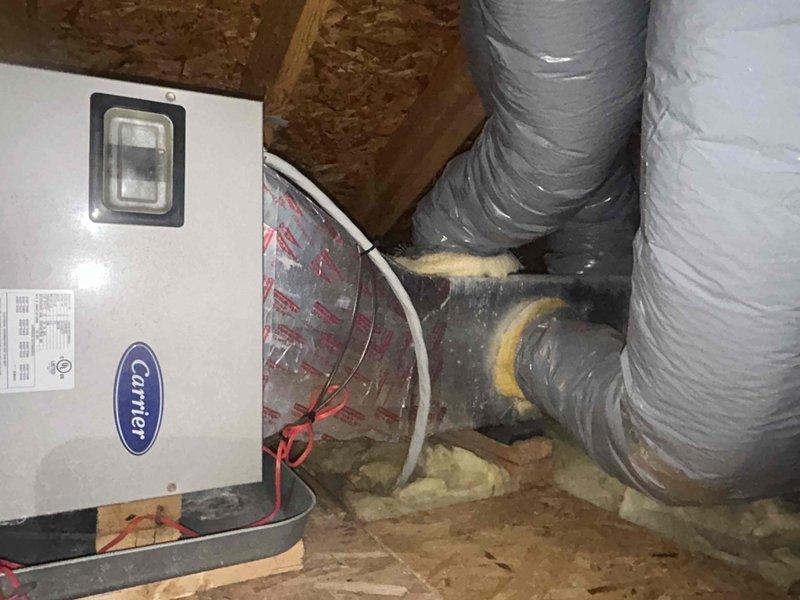 Responded to no cooling call on geothermal heat pump system. Upon arrival, unit was not operational. Verified electrical supply at breaker panel - all breakers in proper position. Inspected Carrier air handler in attic space and control board connections. Diagnosed failed control board preventing unit operation. Replaced defective circuit board and verified all wire terminations at TB1 terminal block secure. Tested system operation - unit now running properly with cooling restored.
