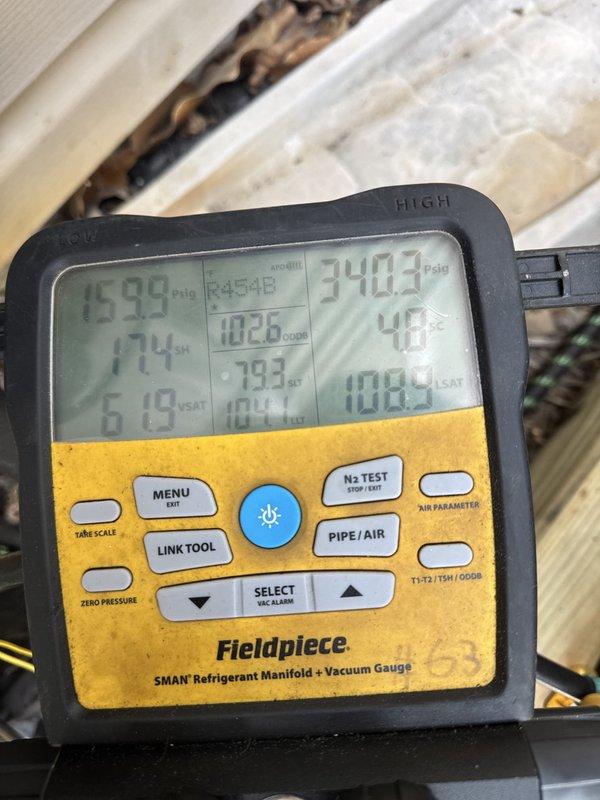 Completed full HVAC system replacement including removal and disposal of existing equipment. Installed 2-ton 17 SEER heat pump outdoor unit (5A6H7024) on pressure-treated wood platform with electrical whip and disconnect. Installed variable speed fan coil unit (5TEM6B02) in attic space with drain pan and shut-off valve. Added 10KW electric heat strip with breaker (HTR1510BRKR) for supplemental heating. Installed 1-inch filter rack and WiFi-enabled thermostat (THX1200W) for system control. Flushed existing refrigeration lines, performed pressure test to verify system integrity, and recharged system to manufacturer specifications. Verified proper system operation with manifold gauges showing appropriate pressures and temperatures across both high and low sides. System commissioned and operational for this 2-system home with 1-year contract extension included.
