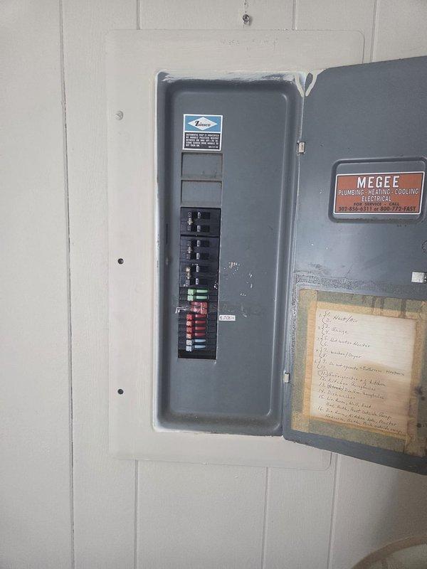 Responded to no cooling call with thermostat set to 67°F but reading 85°F with rising indoor temperature. Upon arrival, verified system was shut off at breaker panel as previously instructed. Documented electrical panel configuration and thermostat settings showing cooling mode engaged but unit not operating, indicating potential equipment failure requiring further diagnosis or component replacement.