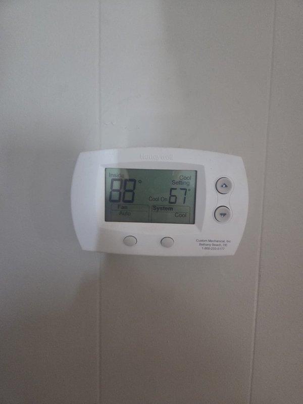Responded to no cooling call with thermostat set to 67°F but reading 85°F with rising indoor temperature. Upon arrival, verified system was shut off at breaker panel as previously instructed. Documented electrical panel configuration and thermostat settings showing cooling mode engaged but unit not operating, indicating potential equipment failure requiring further diagnosis or component replacement.