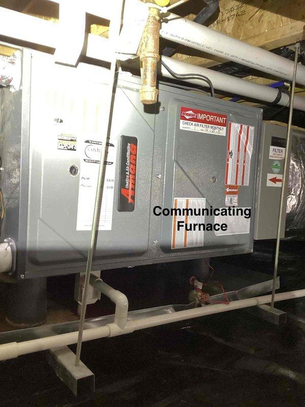 Responded to emergency no-cooling call for heat pump system showing error code on thermostat. Upon arrival, found 2015 original equipment communicating furnace and air handler installation in basement/attic configuration. Diagnosed system fault, cleared error code, and verified proper operation of heat pump components. Documented equipment condition with photos showing furnace unit with communicating technology, associated ductwork including 20x20 plenum, and PVC condensate drainage system. System restored to normal cooling operation.