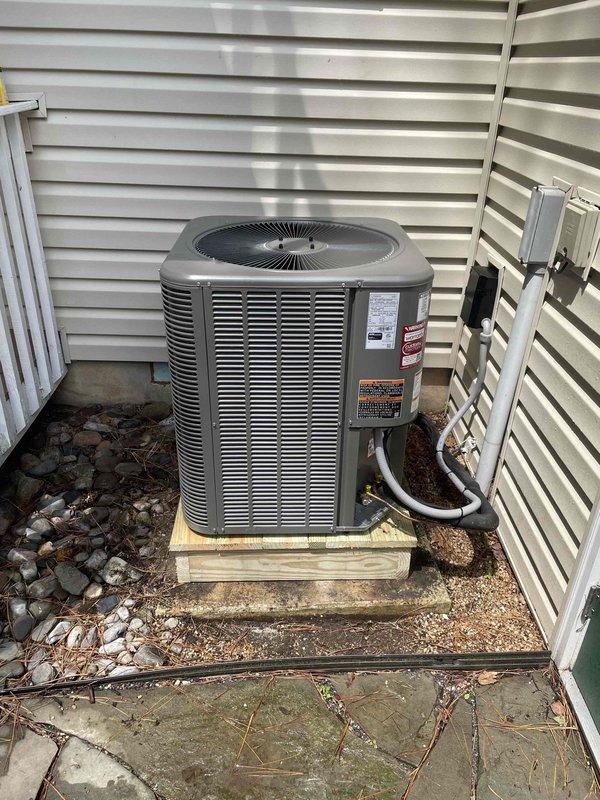 Completed full HVAC system replacement including removal and disposal of existing equipment. Installed ML14KP1-030 heat pump outdoor unit on wooden platform with proper leveling and securing. Mounted CBK45UHVT-030 variable speed air handler in attic space with drain pan and shut-off valve. Installed electrical whip and disconnect box at outdoor unit location. Flushed, pressure tested, and recharged refrigeration lines to manufacturer specifications. Integrated 10KW electric heat strips with dedicated breakers for auxiliary heating. Installed and programmed WiFi-enabled thermostat for remote system control and monitoring. All components tested and verified operational, with one-year extended warranty coverage provided on complete system installation.