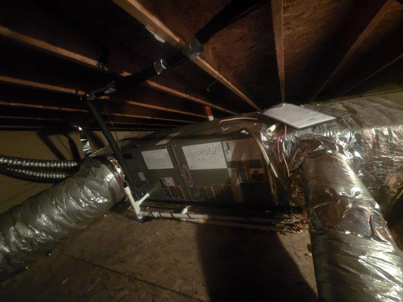 Completed full HVAC system replacement including removal and disposal of existing equipment. Installed ML14KP1-030 heat pump outdoor unit on wooden platform with proper leveling and securing. Mounted CBK45UHVT-030 variable speed air handler in attic space with drain pan and shut-off valve. Installed electrical whip and disconnect box at outdoor unit location. Flushed, pressure tested, and recharged refrigeration lines to manufacturer specifications. Integrated 10KW electric heat strips with dedicated breakers for auxiliary heating. Installed and programmed WiFi-enabled thermostat for remote system control and monitoring. All components tested and verified operational, with one-year extended warranty coverage provided on complete system installation.