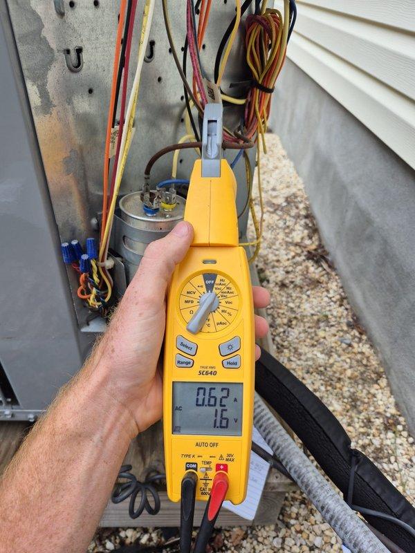 Completed routine cooling maintenance visit on residential air conditioning system. Performed electrical diagnostics using digital multimeter, testing capacitor functionality and verifying proper voltage readings across all electrical components within the outdoor condensing unit. All measurements indicated normal operating parameters, and system was found to be functioning properly with no issues identified requiring immediate attention.