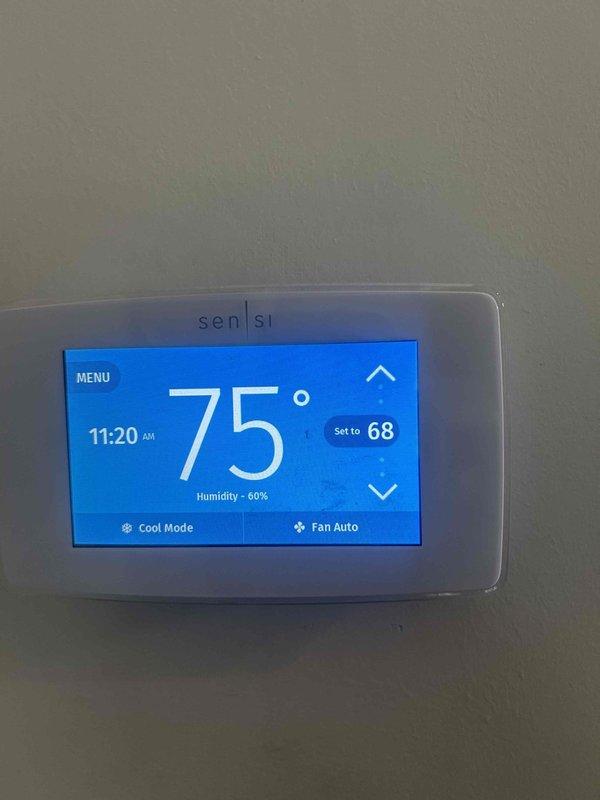 Responded to no cooling complaint on 8-9 year old central air conditioning system. Upon arrival, confirmed thermostat set to cool mode at 68°F while indoor temperature remained at 75°F with 60% humidity, indicating system was running but not producing cold air. Indoor blower operating normally, delivering airflow throughout home, but discharge air temperature was warm rather than conditioned. Diagnosed compressor or refrigerant-related issue preventing heat transfer at outdoor condensing unit. System requires further evaluation of outdoor unit components including compressor operation, refrigerant charge levels, and contactor functionality to restore cooling capacity.
