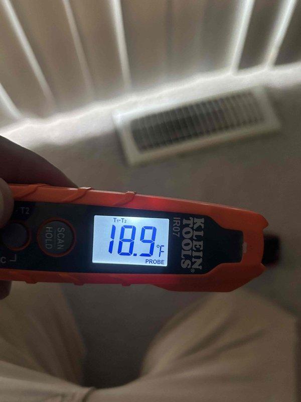 Responded to no cooling complaint on residential HVAC system. Upon inspection, found air handler operating in basement utility area with supply air temperature measuring 18.9°F at register, indicating system is cooling properly. Verified unit functionality, checked refrigerant operation, and confirmed adequate airflow throughout system with no issues detected at time of service.
