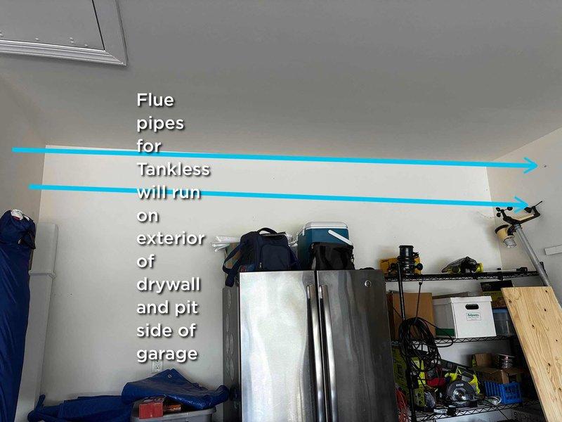 Conducted on-site assessment for tankless water heater installation in residential garage. Evaluated existing space configuration and determined optimal routing for flue pipe system, which will run along exterior of drywall on pit side of garage to ensure proper venting and code compliance. Documented current equipment layout including existing water heater and surrounding storage areas to plan installation pathway and clearance requirements.