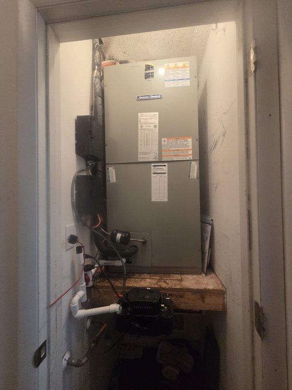 Completed full HVAC system replacement including removal and disposal of existing equipment. Installed 5A6H4042 3.5-ton 14.3 SEER heat pump outdoor unit on existing pad with electrical whip and disconnect. Installed 5TEM6D04 variable speed fan coil unit in interior mechanical closet along with BAYHTR1715BRKR 15KW electric heater with breaker. Flushed, pressure tested, and recharged refrigeration lines to manufacturer specifications. Installed automatic condensation pump with proper drainage, 1-inch filter rack, and S1200W WiFi thermostat for system control. All components mounted securely, electrical connections completed per code, and system tested for proper operation across all modes including heating and cooling cycles.