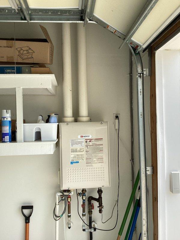 Provided estimate for installation of laundry tub in residential property. Evaluated two potential locations: dedicated laundry room with existing washer/dryer on pedestals and adjacent garage/utility area with tankless water heater. Assessed existing plumbing infrastructure, water supply accessibility, and drainage requirements for both locations to determine optimal placement and installation scope.
