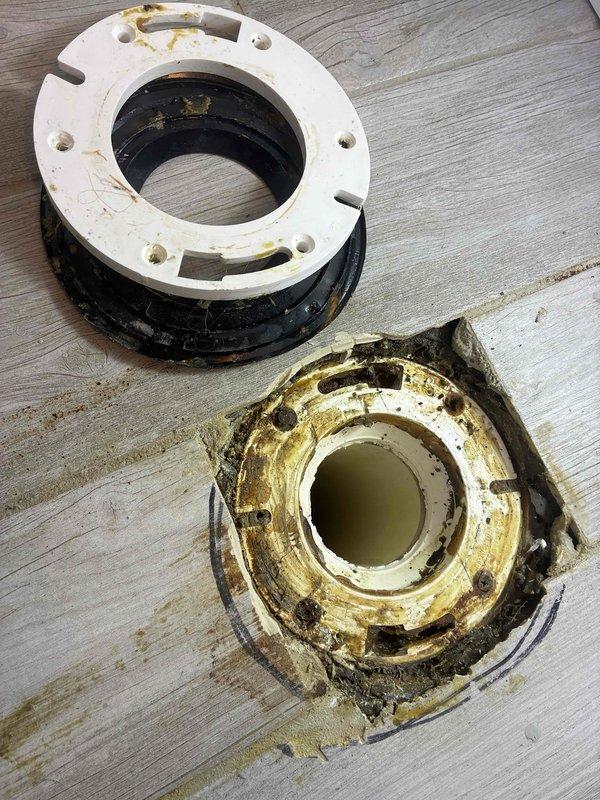 Responded to toilet leaking into crawlspace. Upon inspection, discovered severely corroded and deteriorated toilet flange with extensive rust damage and compromised seal integrity. The existing flange exhibited heavy moisture damage, yellow-brown staining, and degraded metal components that had failed, allowing water to bypass the wax ring and leak through the floor into the crawlspace below. Removed and replaced the damaged toilet flange assembly with new hardware, installed fresh wax ring seal, and properly secured toilet back to floor. Verified proper seal and tested for leaks to ensure no further water intrusion into crawlspace.