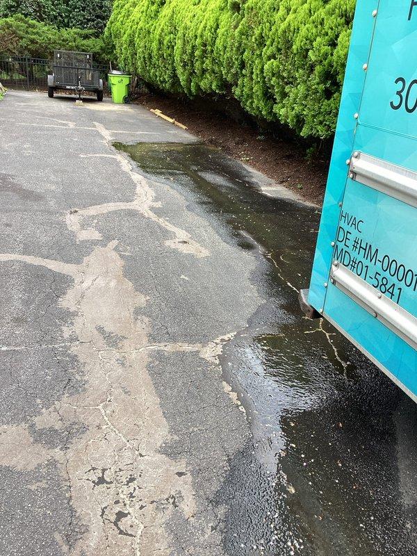 Responded to report of water leaking near driveway and discovered significant water pooling on asphalt surface adjacent to property. Upon investigation, identified active water leak originating from underground supply line, causing continuous flow and accumulation of standing water across paved area near HVAC equipment. Isolated the affected water line, performed necessary repairs to stop the leak, and restored proper water flow to the system while preventing further damage to the driveway and surrounding landscape.