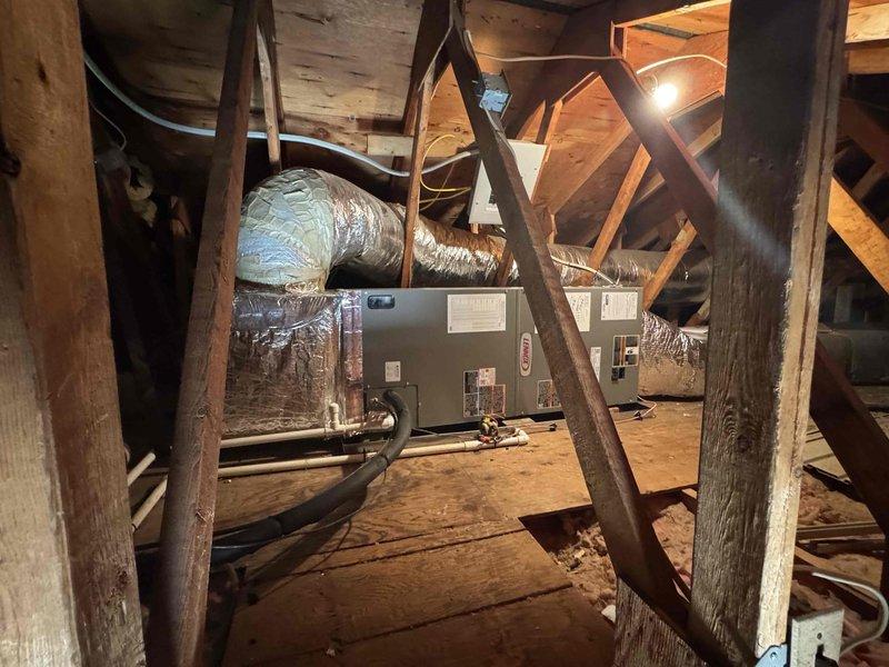 Completed full HVAC system replacement involving removal and disposal of existing equipment. Installed new Lennox ML14KP1-036 3-ton 14 SEER heat pump on pressure-treated wood platform with replacement of outdoor disconnect and electrical whip. In attic space, installed Lennox CBK45UHVT-036 variable speed air handler with 10 kW electric heat pack, fabricated and installed metal duct transitions to adapt to existing ductwork, and reused existing electrical connections, condensation lines, and power lines. Installed 14x24x1 filter grille and Honeywell S1200 digital WiFi thermostat for system control. Extended protection plan coverage one year from previous expiration date. All equipment tested and operational upon completion.