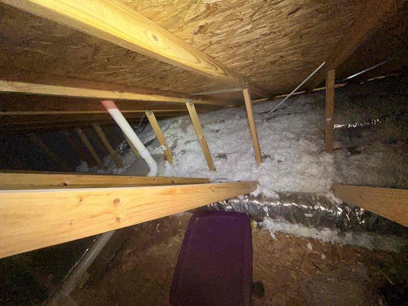 Performed preventative maintenance cooling visit in response to system not reaching set temperature during hot days. Inspected attic-mounted HVAC equipment and assessed insulation coverage and clearance measurements for proper system operation and airflow requirements.