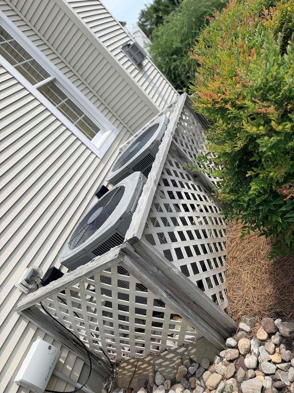 Responded to service call for HVAC system evaluation on 2016 Trane unit (Model TEM6A0C36H31SA, Serial 161810FW2V) located in garage. Upon inspection, discovered cracked evaporator coil drain pan requiring replacement. Provided estimate for upflow evaporator drain pan replacement on downstairs system, which will require refrigerant pump down procedure to safely remove coil assembly and replace filter drier during repair. Documented current system status with thermostat set to cooling mode at 82 degrees and exterior condenser unit mounted on elevated platform with lattice enclosure. Advised parts availability and coordinated scheduling for replacement work requiring one technician and approximately three hours to complete pump down, drain pan replacement, and filter drier installation.